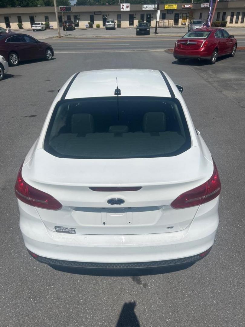 2016 WHITE FORD FOCUS SE (1FADP3F21GL) with an 2.0L engine, Automatic transmission, located at 2514 Williamson Rd NE, Roanoke, VA, 24012, (540) 265-7770, 37.294636, -79.936249 - NO CREDIT CHECK FINANCING WITH ONLY $2200 DOWN PAYMENT!!!! Check out our website www.needausedvehicle.com for our No Credit Check/ In House Financing options!! No Credit Check Available!!! In House Financing Available!!! All Clean Title Vehicles (no Salvaged or flooded vehicles ever on our lot)! - Photo#11
