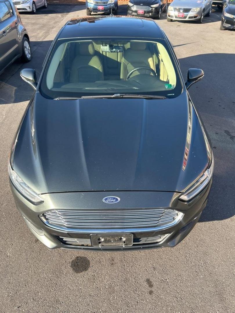2015 GREEN FORD FUSION SE (3FA6P0HD5FR) with an 1.5L engine, Automatic transmission, located at 2514 Williamson Rd NE, Roanoke, VA, 24012, (540) 265-7770, 37.294636, -79.936249 - Photo#10