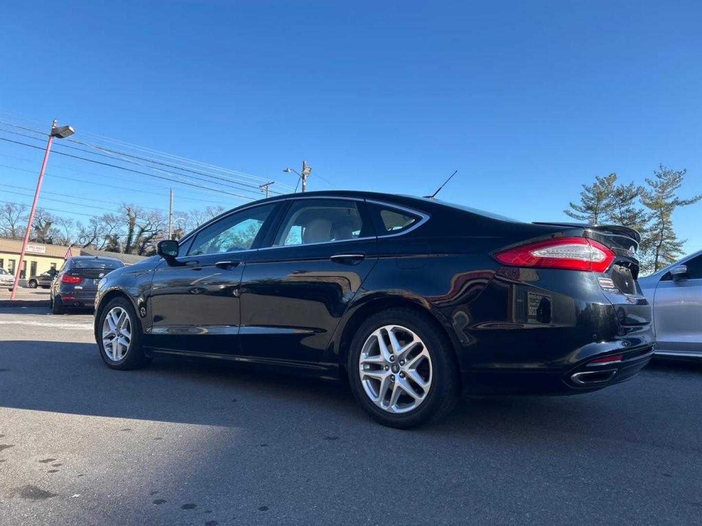2016 BLACK FORD FUSION TITANIUM (3FA6P0K9XGR) with an 2.0L engine, Automatic transmission, located at 2514 Williamson Rd NE, Roanoke, VA, 24012, (540) 265-7770, 37.294636, -79.936249 - Photo#1