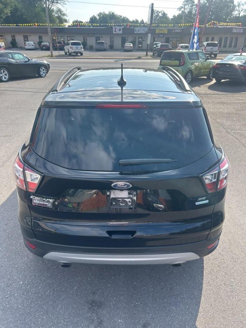 2018 BLACK FORD ESCAPE SE (1FMCU0GD1JU) with an 1.5L engine, Automatic transmission, located at 2514 Williamson Rd NE, Roanoke, VA, 24012, (540) 265-7770, 37.294636, -79.936249 - NO CREDIT CHECK FINANCING WITH ONLY $2800 DOWN PAYMENT!!!! Check out our website www.needausedvehicle.com for our No Credit Check/ In House Financing options!! No Credit Check Available!!! In House Financing Available!!! All Clean Title Vehicles (no Salvaged or flooded vehicles ever on our lot)! - Photo#3