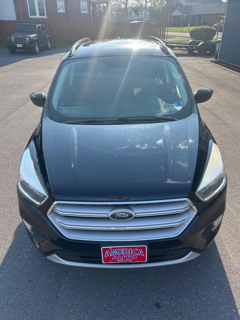 2018 BLACK FORD ESCAPE SE (1FMCU0GD1JU) with an 1.5L engine, Automatic transmission, located at 2514 Williamson Rd NE, Roanoke, VA, 24012, (540) 265-7770, 37.294636, -79.936249 - Photo#1
