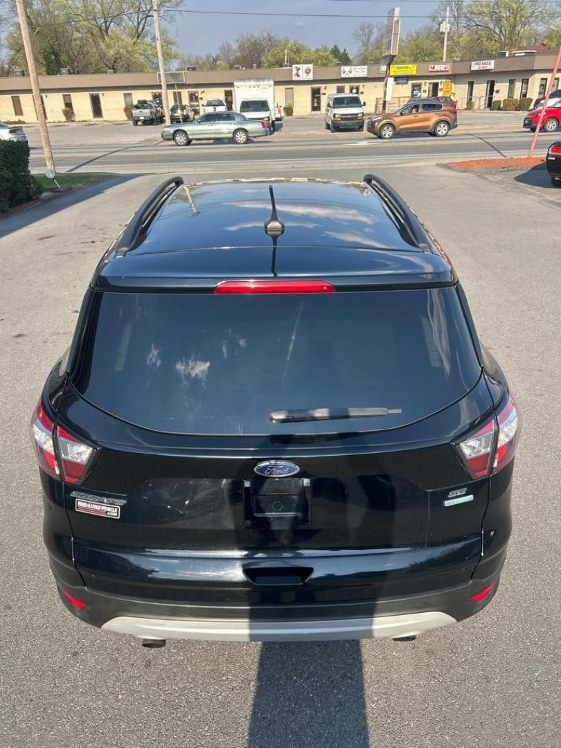 2018 BLACK FORD ESCAPE SE (1FMCU0GD1JU) with an 1.5L engine, Automatic transmission, located at 2514 Williamson Rd NE, Roanoke, VA, 24012, (540) 265-7770, 37.294636, -79.936249 - Photo#3