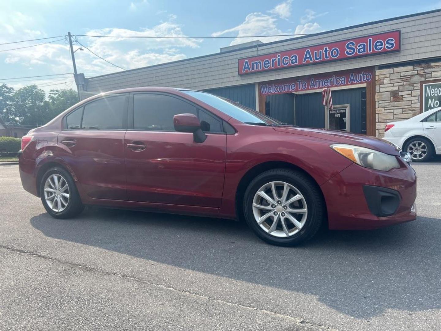 2013 RED SUBARU IMPREZA PREMIUM (JF1GJAC66DH) with an 2.0L engine, Continuously Variable transmission, located at 2514 Williamson Rd NE, Roanoke, VA, 24012, (540) 265-7770, 37.294636, -79.936249 - Photo#0
