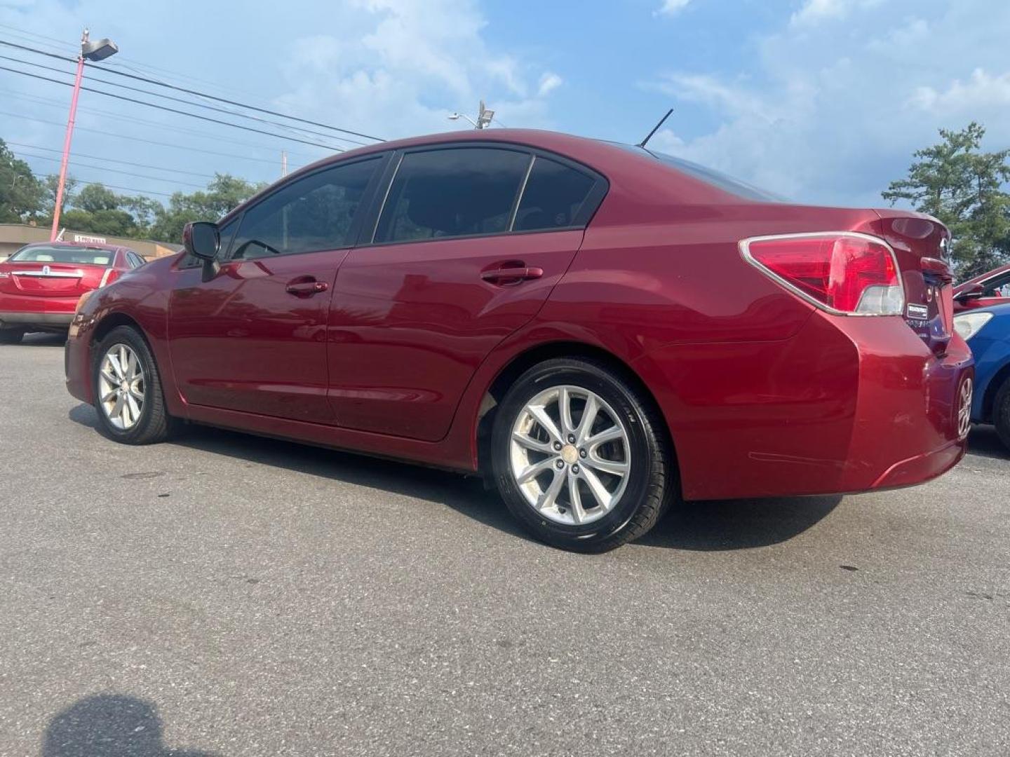 2013 RED SUBARU IMPREZA PREMIUM (JF1GJAC66DH) with an 2.0L engine, Continuously Variable transmission, located at 2514 Williamson Rd NE, Roanoke, VA, 24012, (540) 265-7770, 37.294636, -79.936249 - Photo#1