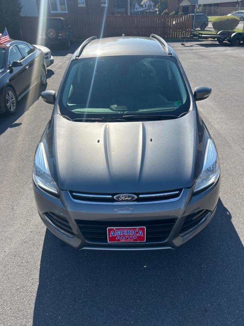 2014 GRAY FORD ESCAPE TITANIUM (1FMCU9JX4EU) with an 1.6L engine, Automatic transmission, located at 2514 Williamson Rd NE, Roanoke, VA, 24012, (540) 265-7770, 37.294636, -79.936249 - NO CREDIT CHECK FINANCING WITH ONLY $3500 DOWN PAYMENT!!!! Check out our website www.needausedvehicle.com for our No Credit Check/ In House Financing options!! No Credit Check Available!!! In House Financing Available!!! All Clean Title Vehicles (no Salvaged or flooded vehicles ever on our lot)! - Photo#1