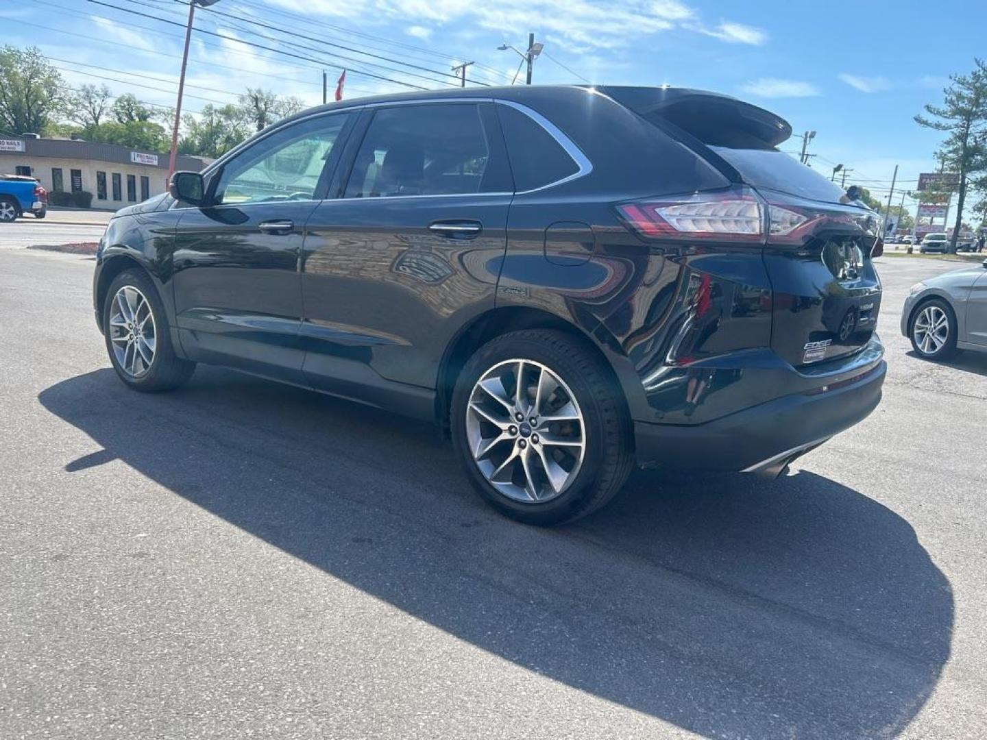 2015 BLACK FORD EDGE TITANIUM (2FMPK4K96FB) with an 2.0L engine, Automatic transmission, located at 2514 Williamson Rd NE, Roanoke, VA, 24012, (540) 265-7770, 37.294636, -79.936249 - NO CREDIT CHECK FINANCING WITH ONLY $3800 DOWN PAYMENT!!!! Check out our website www.needausedvehicle.com for our No Credit Check/ In House Financing options!! No Credit Check Available!!! In House Financing Available!!! All Clean Title Vehicles (no Salvaged or flooded vehicles ever on our lot)! - Photo#1